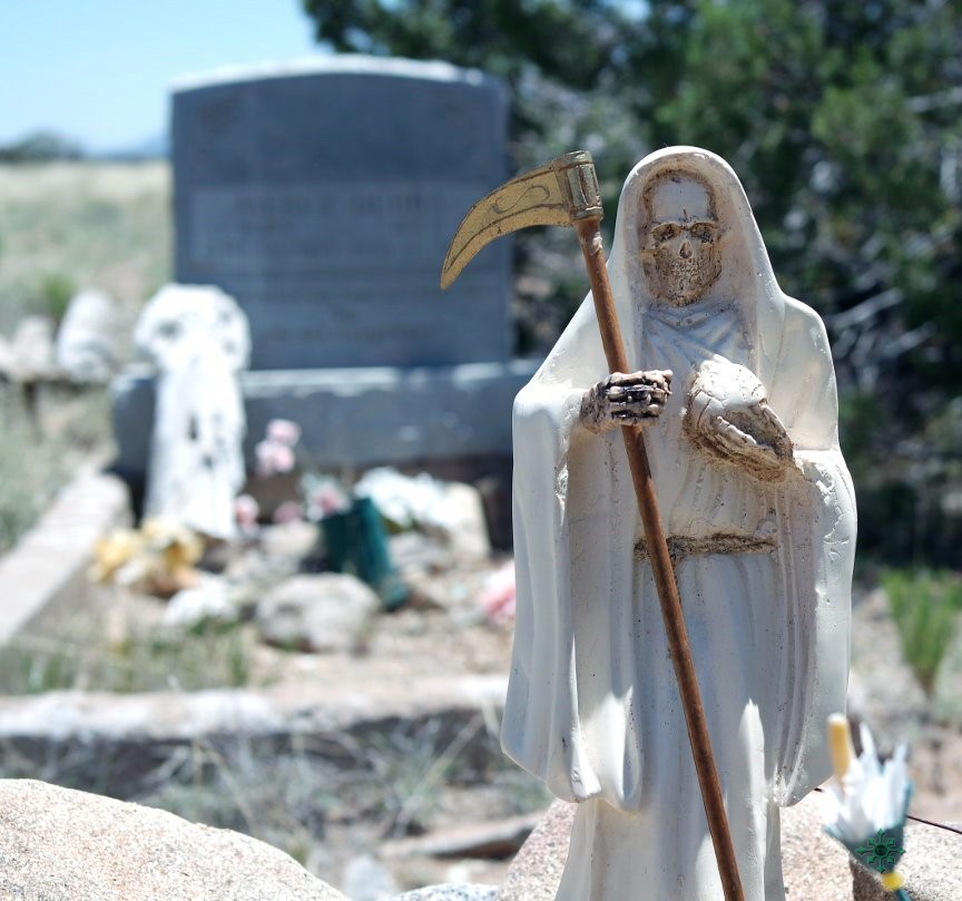 white Santa Muerte in hippie graveyard