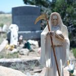 white Santa Muerte in hippie graveyard